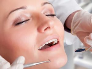 A woman receiving care from a sedation dentist